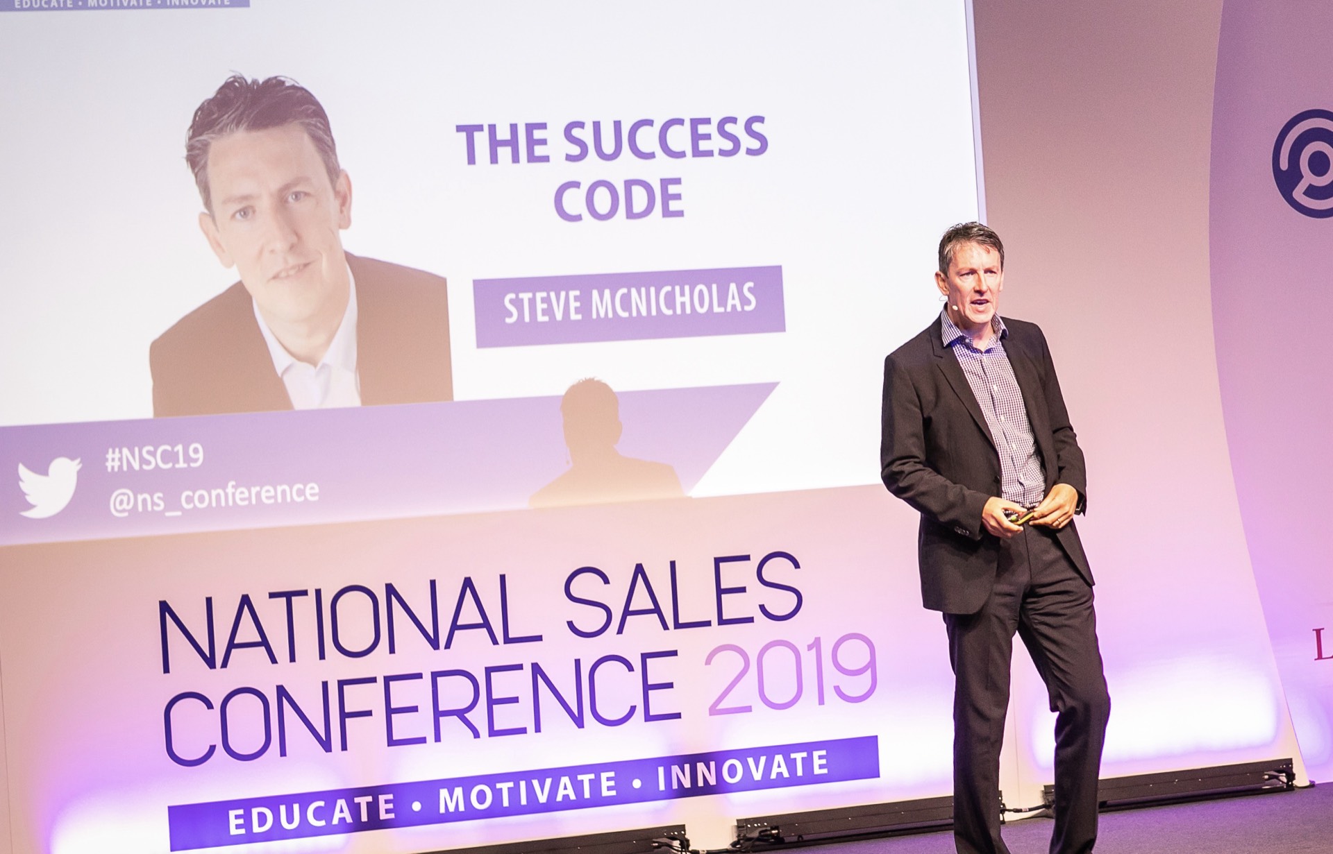Steve McNicholas speaking on stage at the National Sales Conference